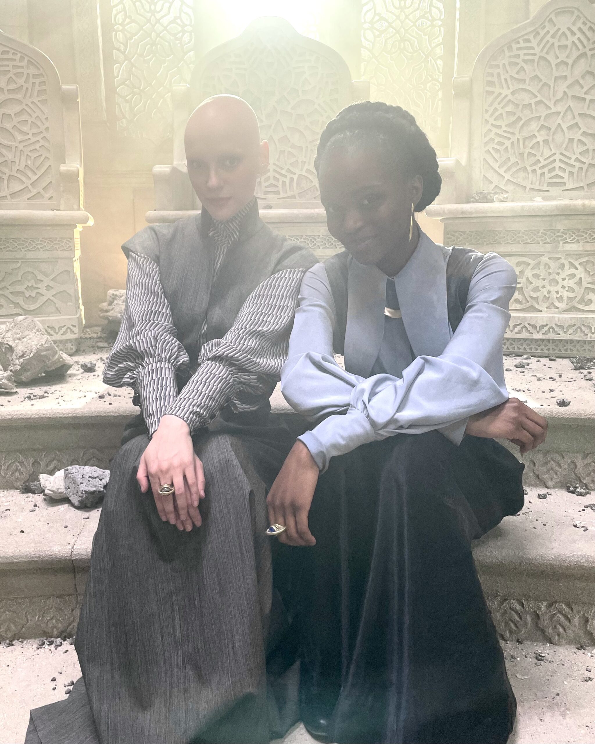 A behind the scenes picture of actor Joelle with Olumide Olorufemi on the set of The Wheel of Time Season 3 dressed as their charaters Joiya Byir and Ispan Shefar from the show.